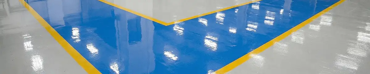 A factory floor professionally covered and marked with epoxy flooring in Knoxville, TN