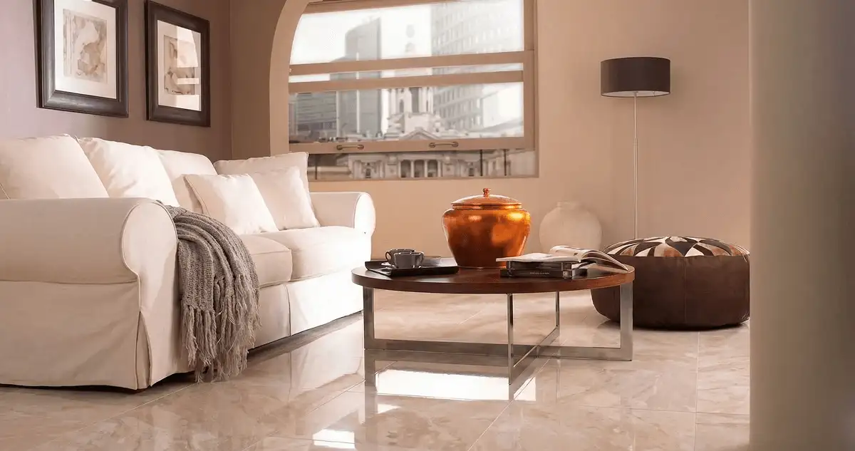 Modern living room with professionally installed marble flooring, a beige sofa, coffee table in Knoxville, TN