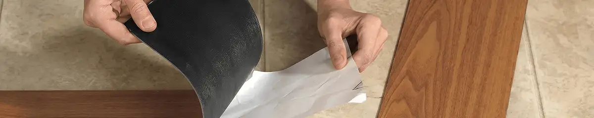 A professional installing vinyl flooring in Knoxville, TN