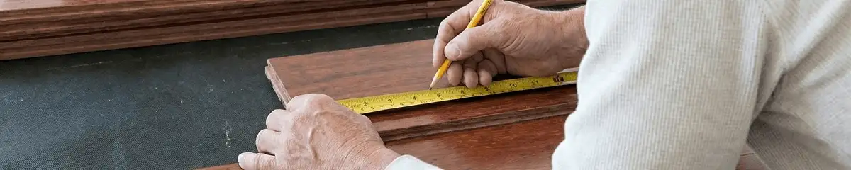 A professional installing wood flooring in Knoxville, TN
